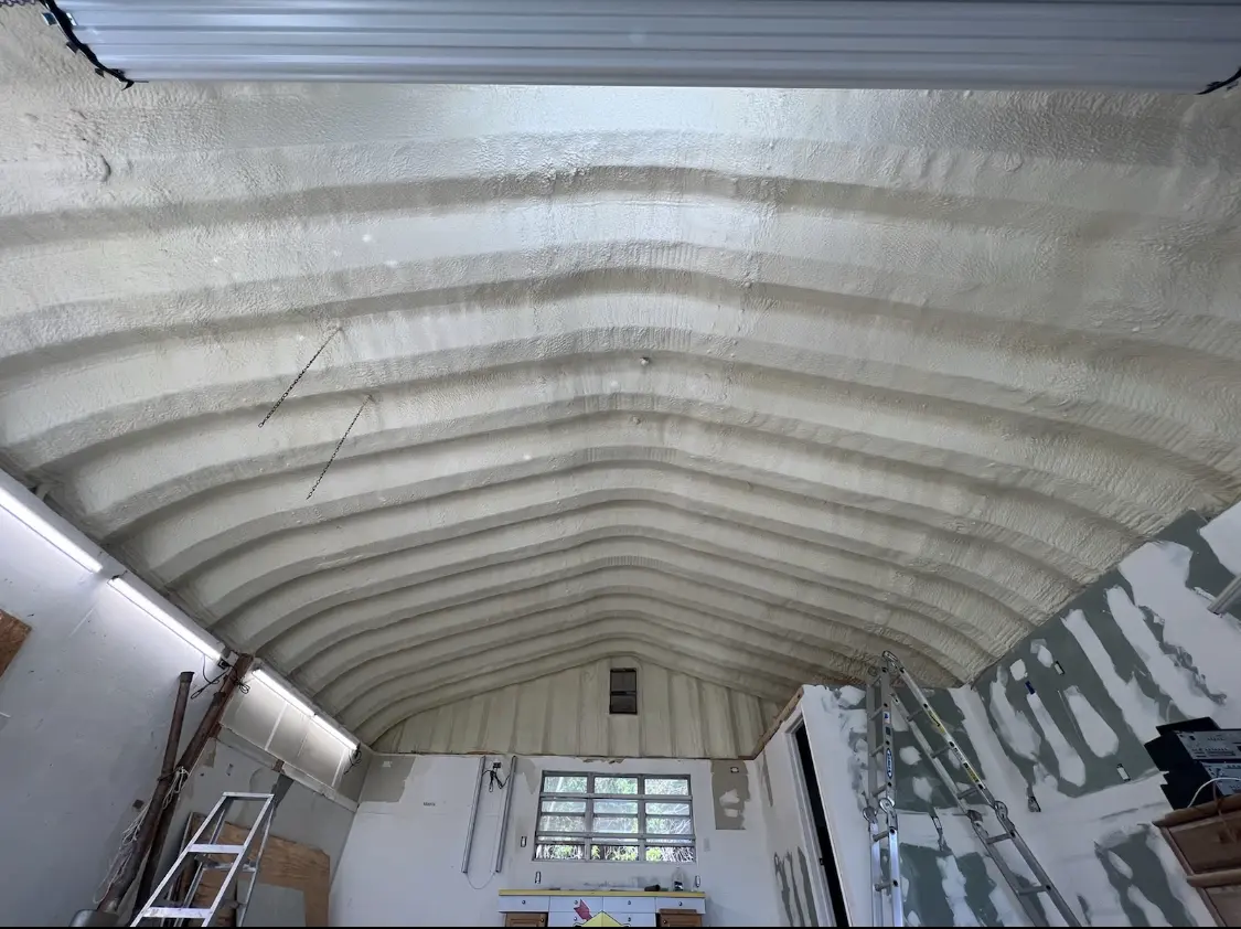 Spray polyurethane foam applied to the underside of a metal roof deck in Temescal Valley